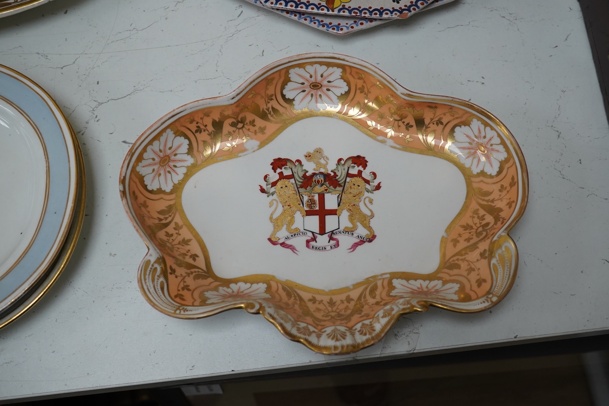 A Chamberlains Worcester armorial dessert dish, and a Spode armorial plate ‘The London’, c.1825 (produced for the Captain of the Ship 'The London’), both bearing the arms of the British East India Company, together with